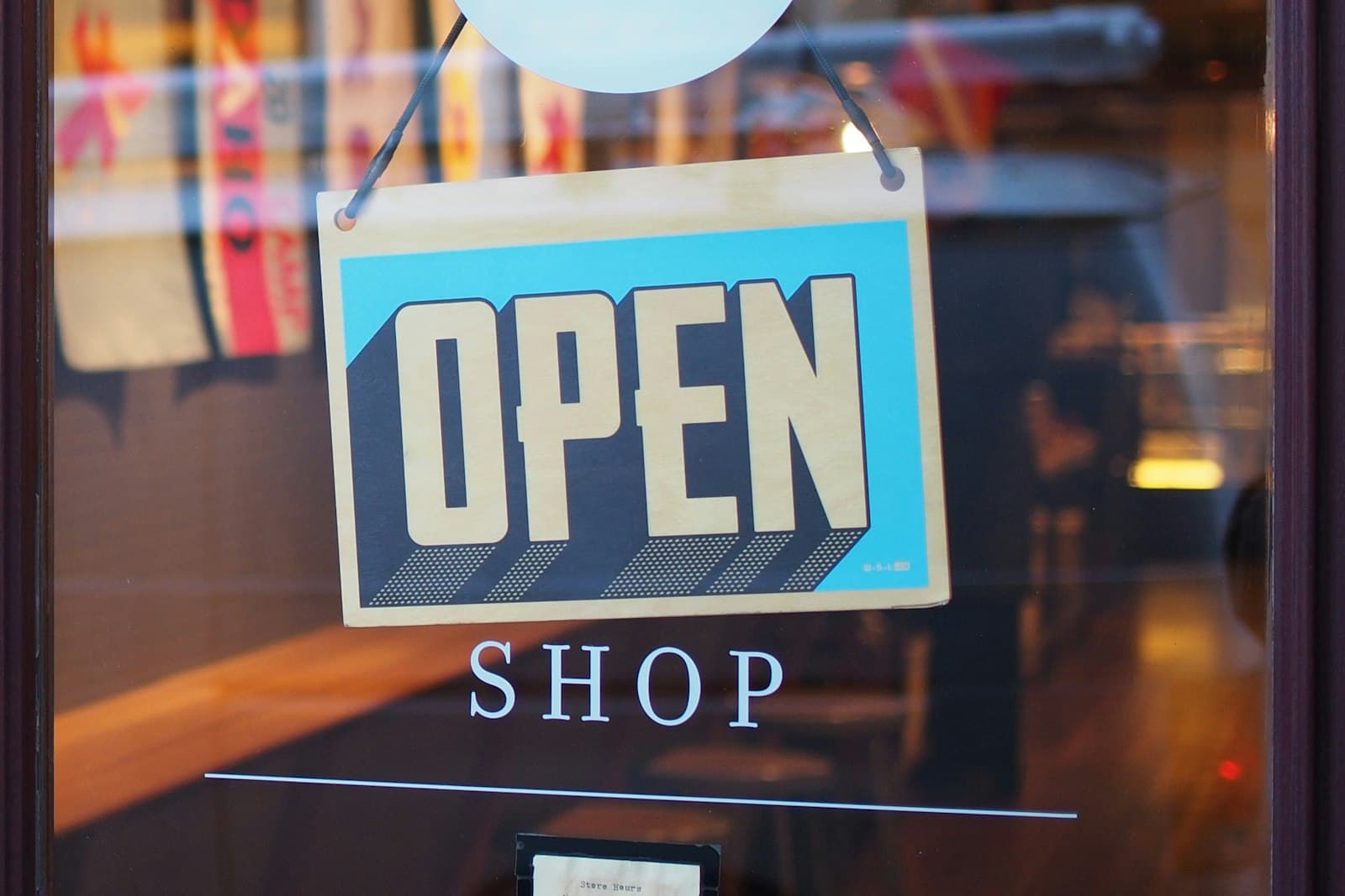 Small business owner standing in front of her shop in Vienna