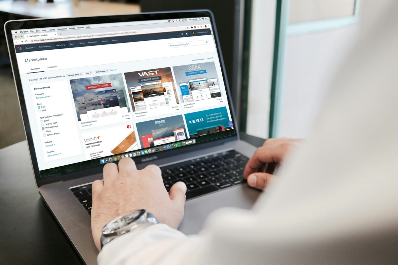 Laptop showing the legal notice page of a business website on a desk